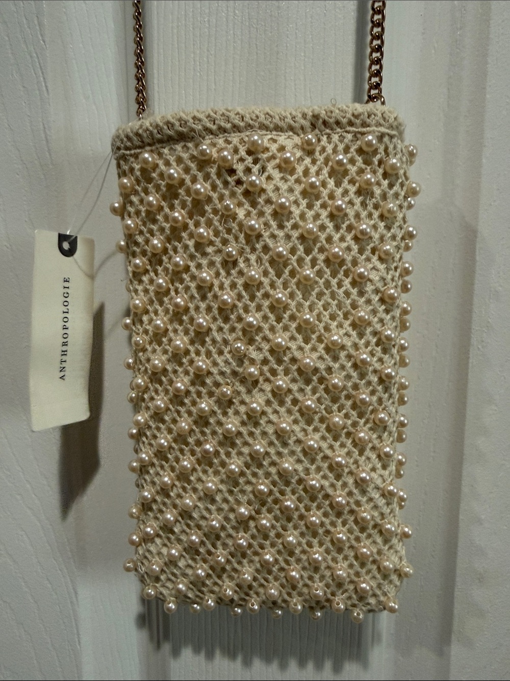 Anthropologie- pearl decorated Phone bag